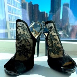 Jimmy Choo black suede, patent and lace stilettos.